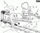 La máquina de vapor Thomas en un paso a nivel con barrera